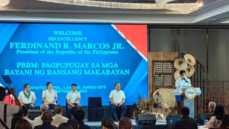 Pres Marcos leads distribution of aid to families of slain and wounded enforcers