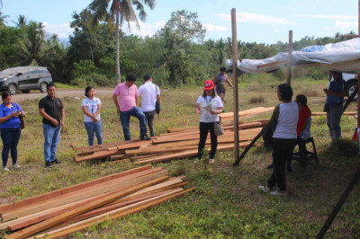 8 families affected  by flooding in Mati City receive bldg. materials